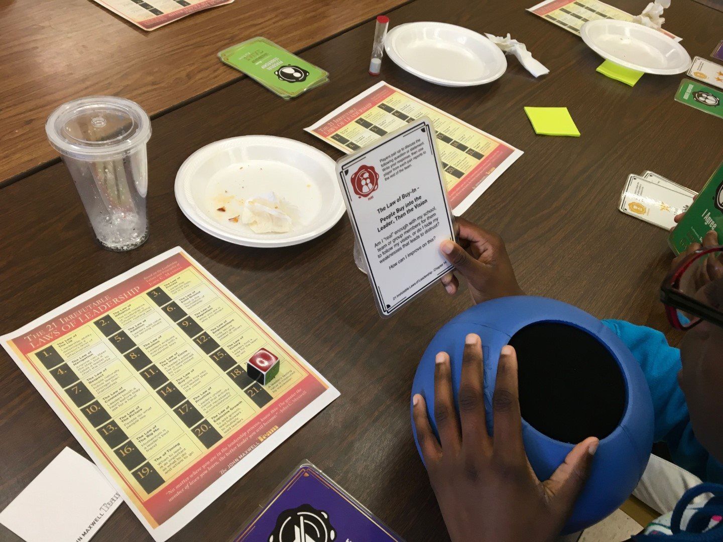 A person is holding a card that says ' i love you ' on it