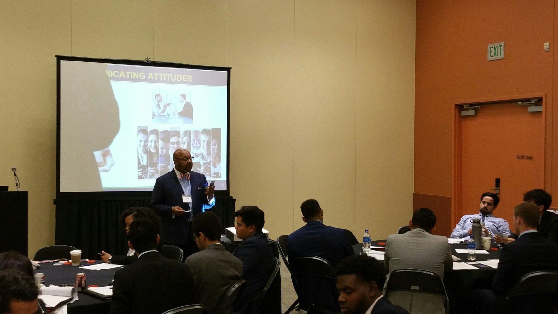 A man is giving a presentation to a group of people