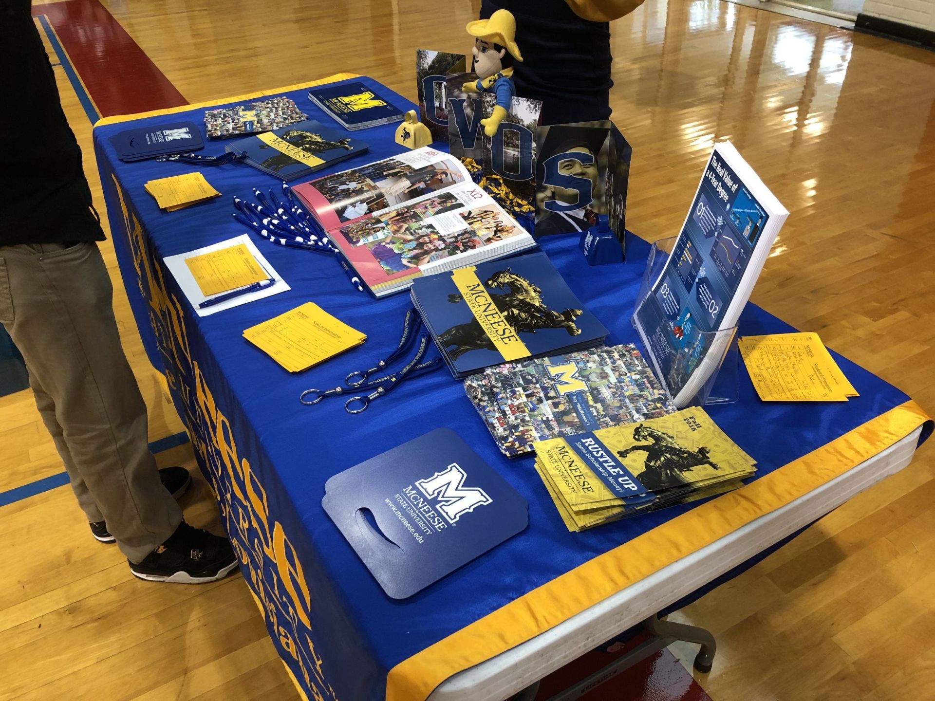 A table with a blue table cloth and a book on it