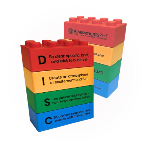 A stack of lego blocks with assessments 24 7 written on them