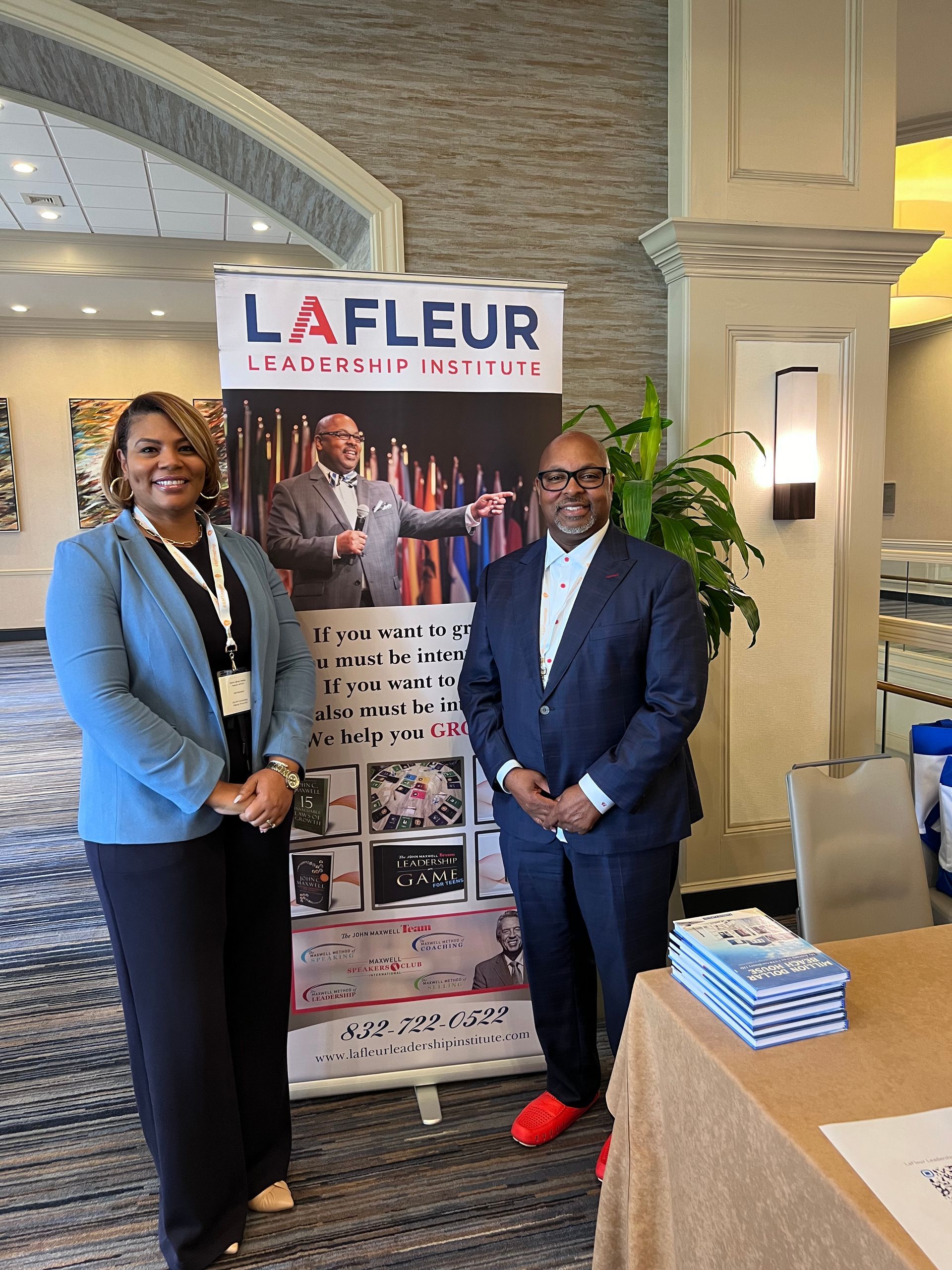 A man and a woman are posing for a picture in a room