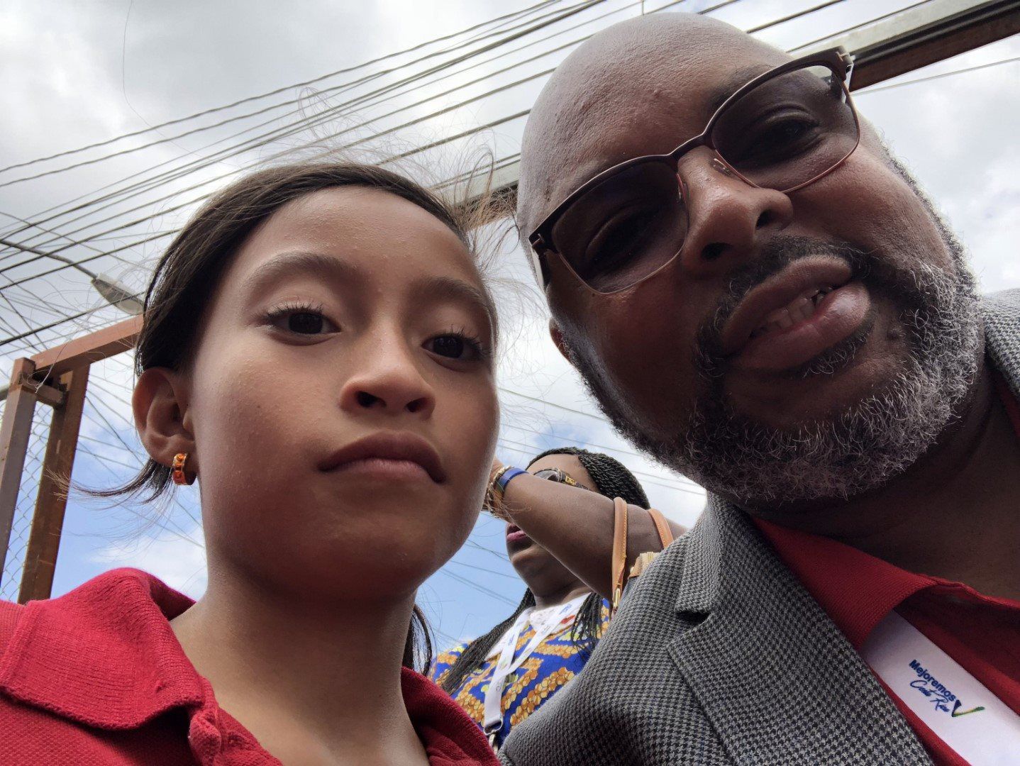 A man and a little girl are posing for a picture