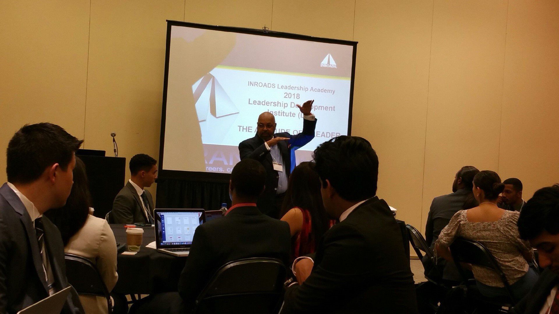 A man is giving a presentation to a group of people