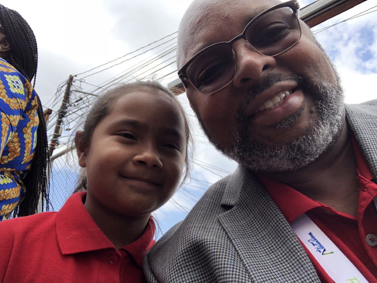A man and a little girl are posing for a picture.