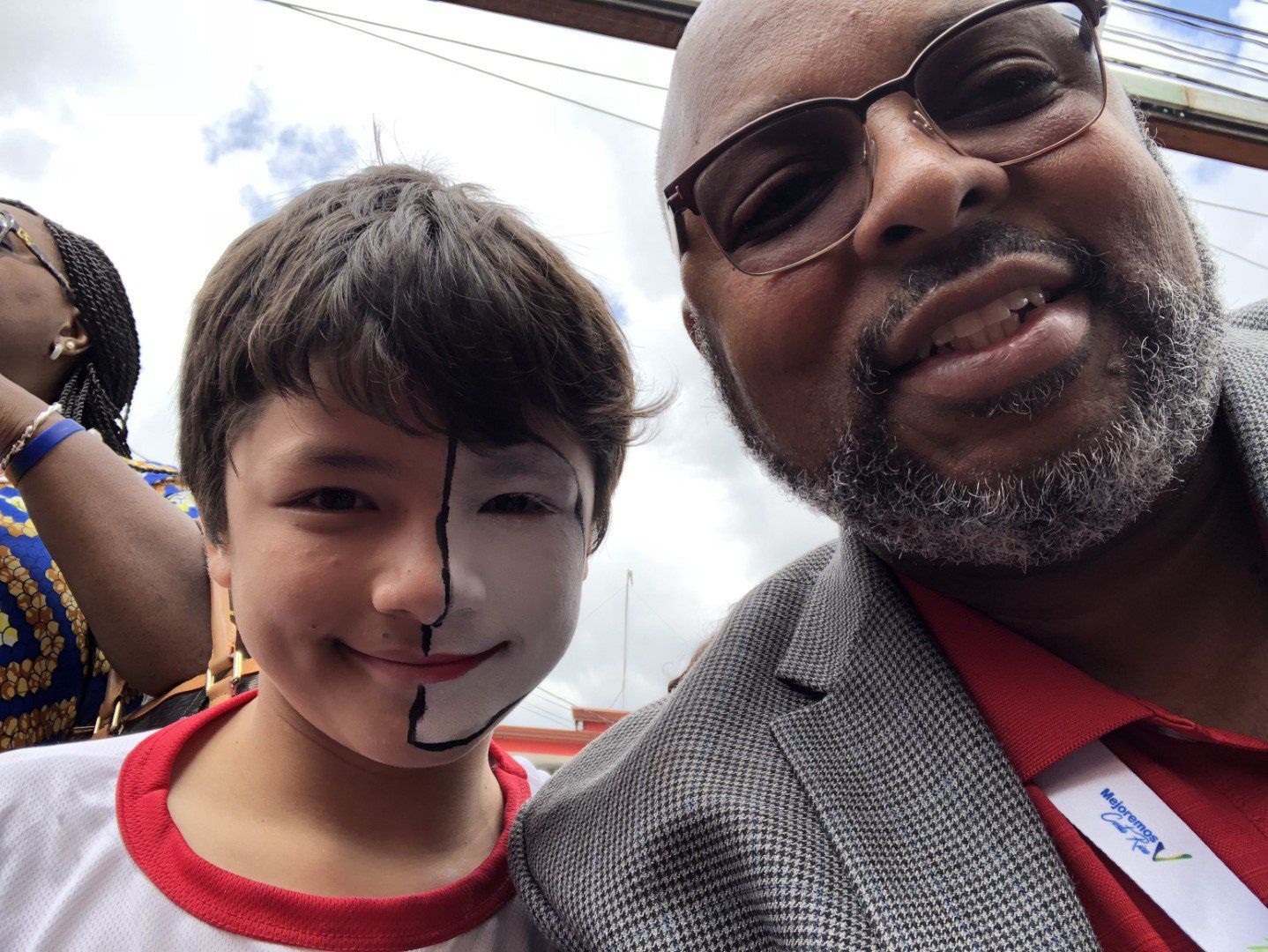 A man and a young boy are posing for a picture