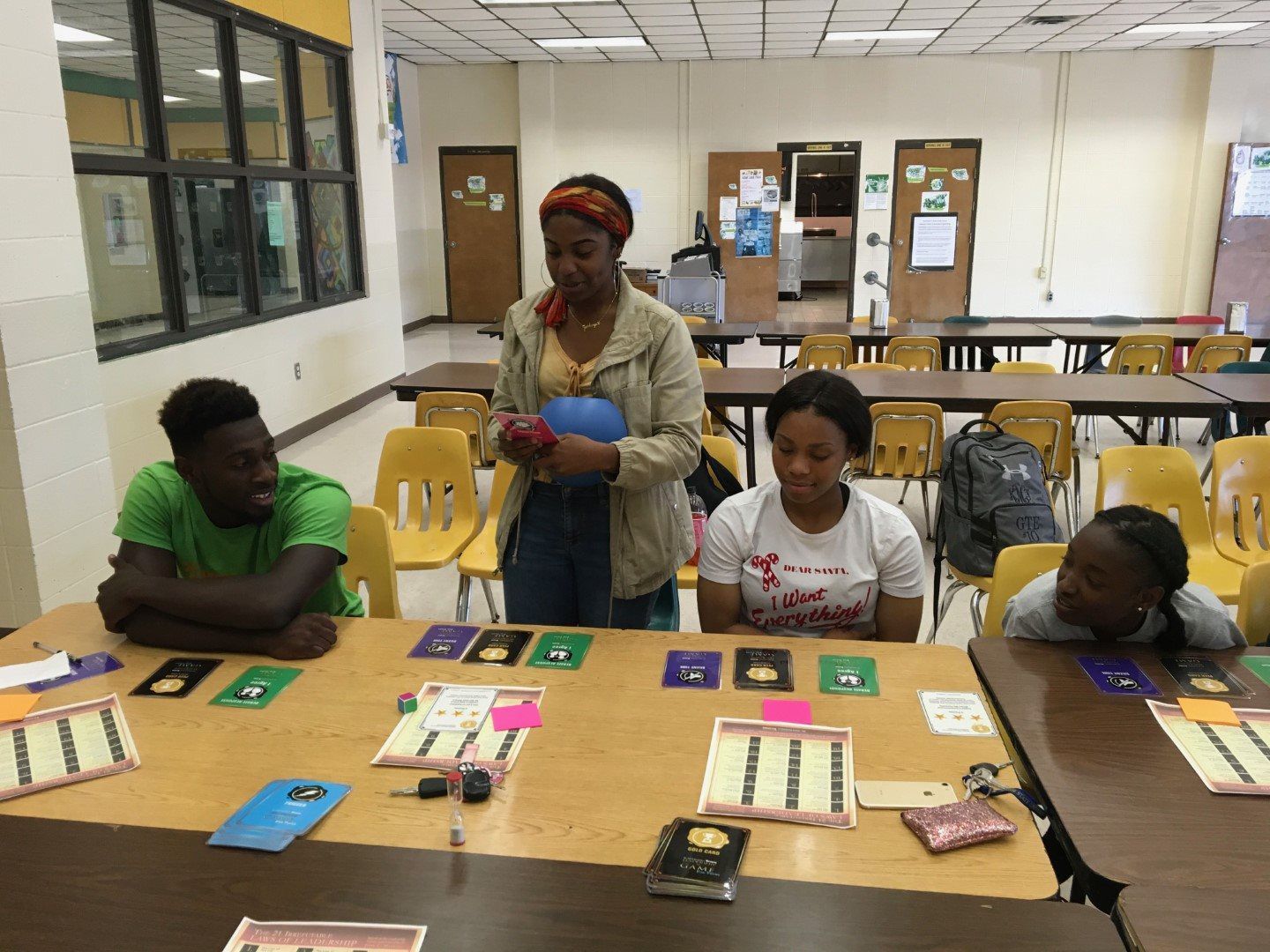 A group of people are sitting at tables in a room.