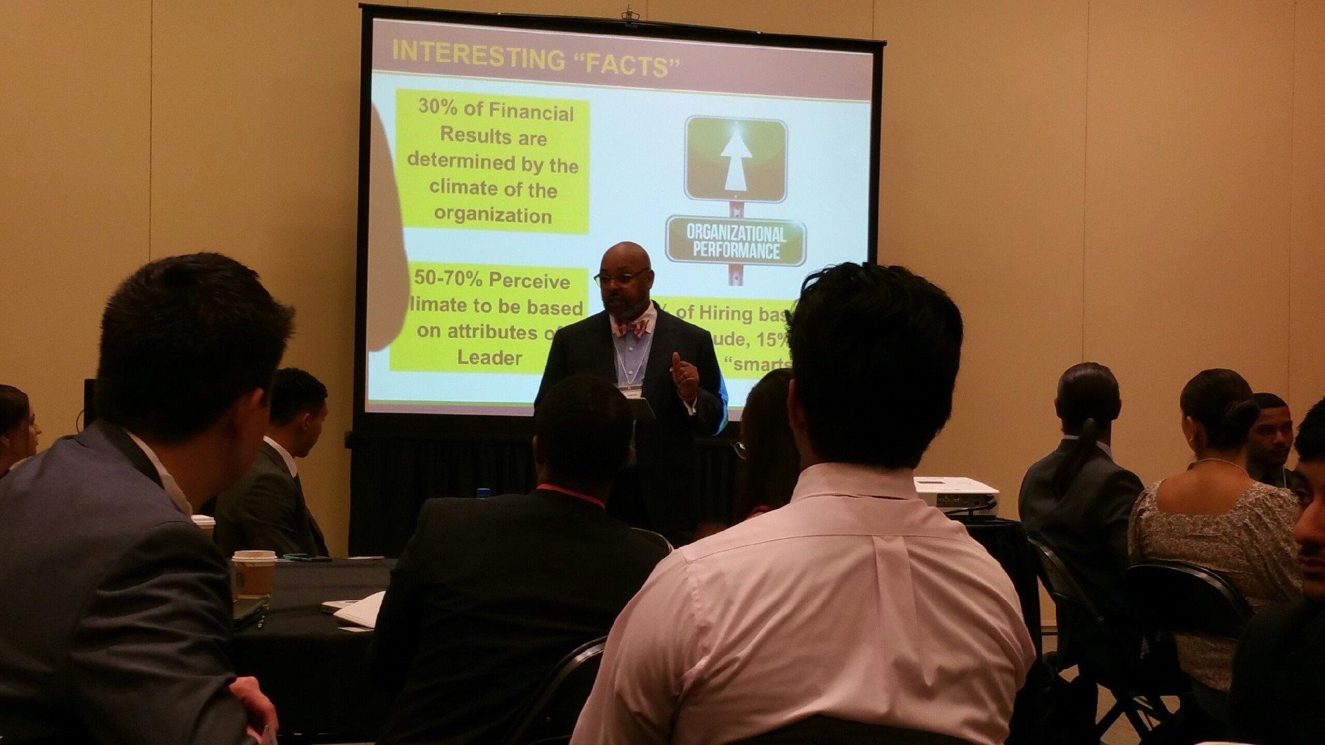 A man is giving a presentation to a group of people