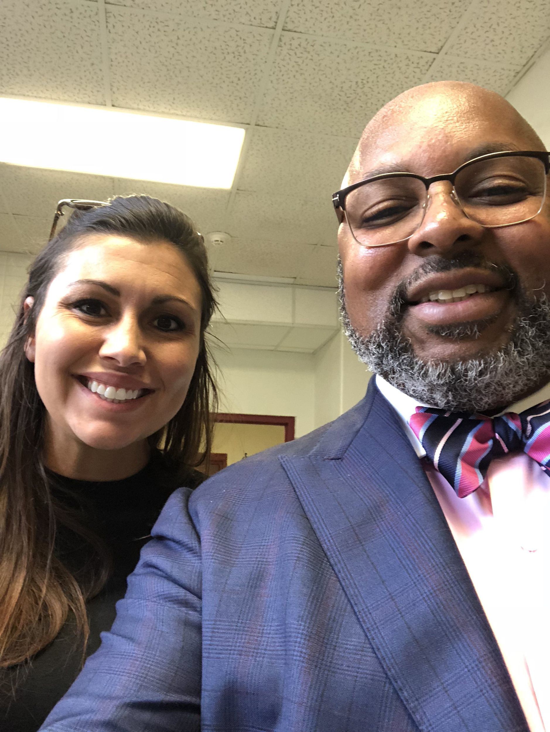 A man and a woman are posing for a picture together