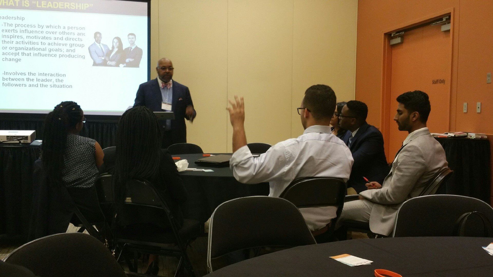 A man is giving a presentation to a group of people