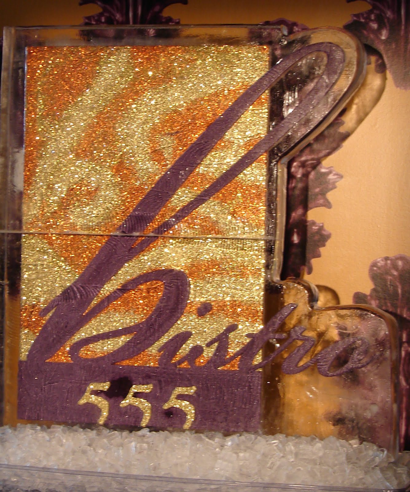 A purple and gold item with the number 555 on it