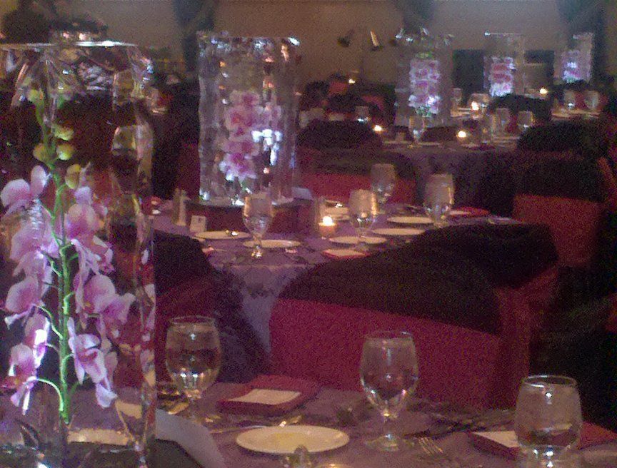 A table with a vase of flowers on it