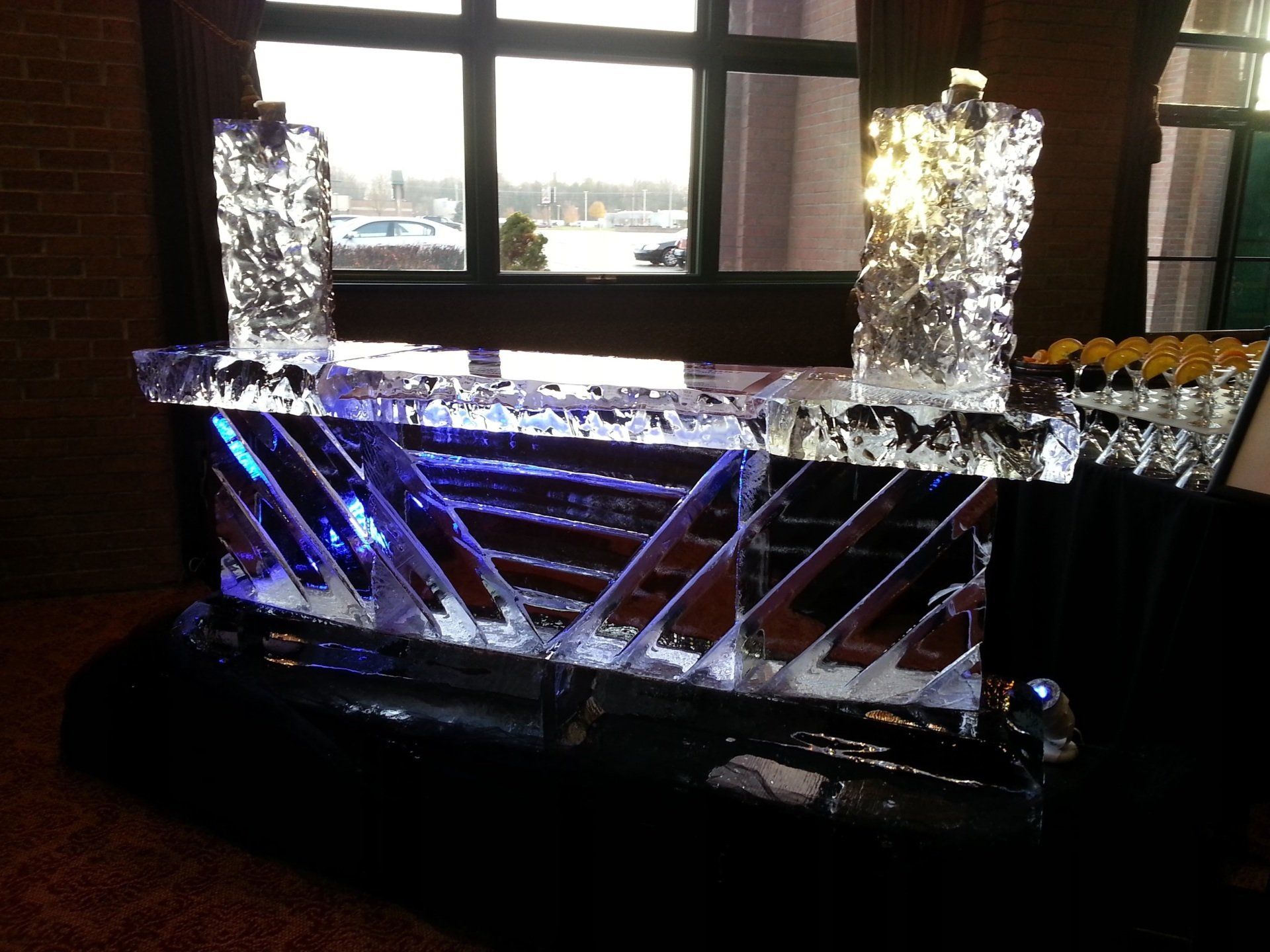 A bar made of ice with a window in the background