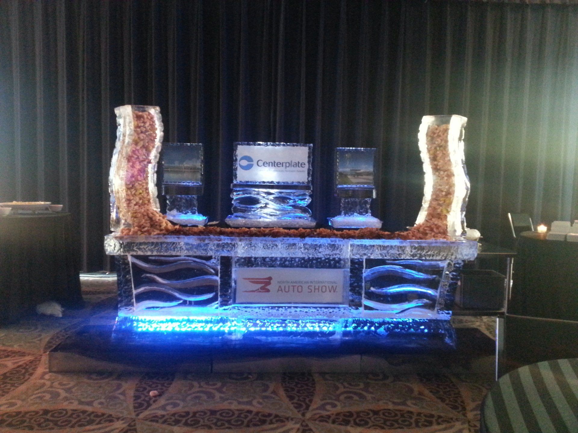 A table with ice sculptures and a sign that says enterprise