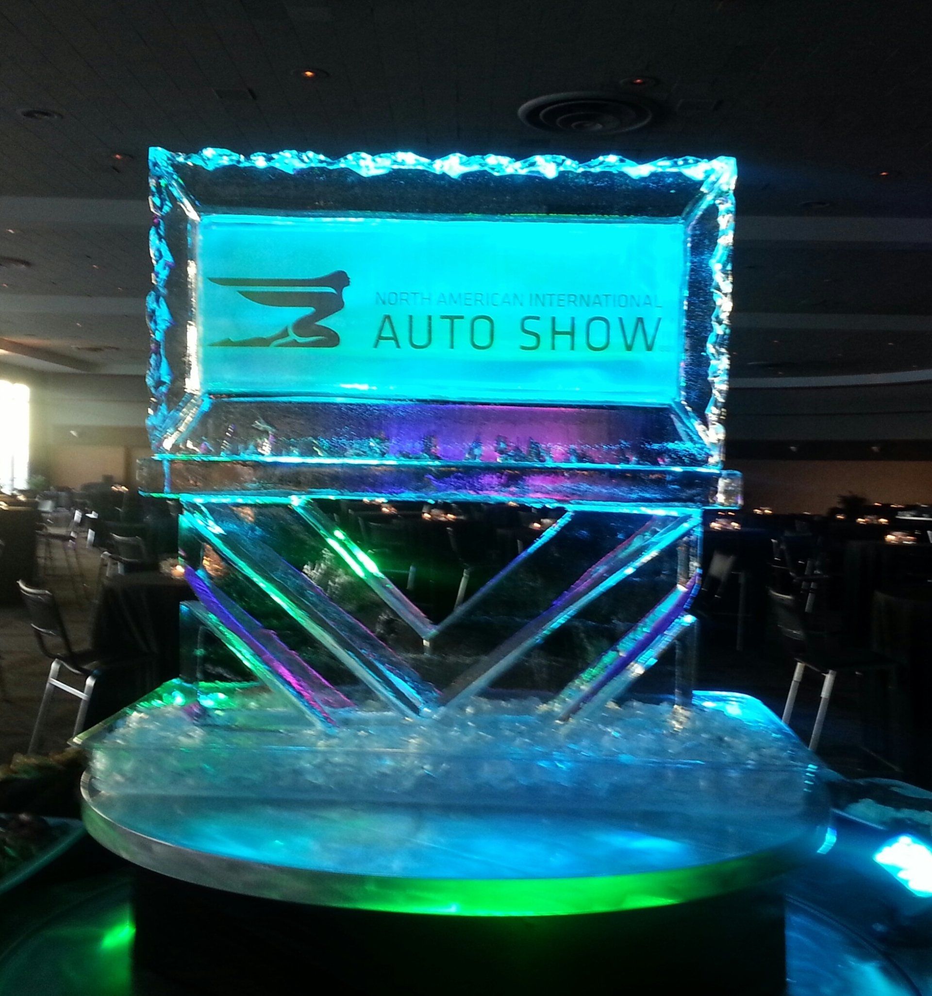 A large ice sculpture with the word auto show on it