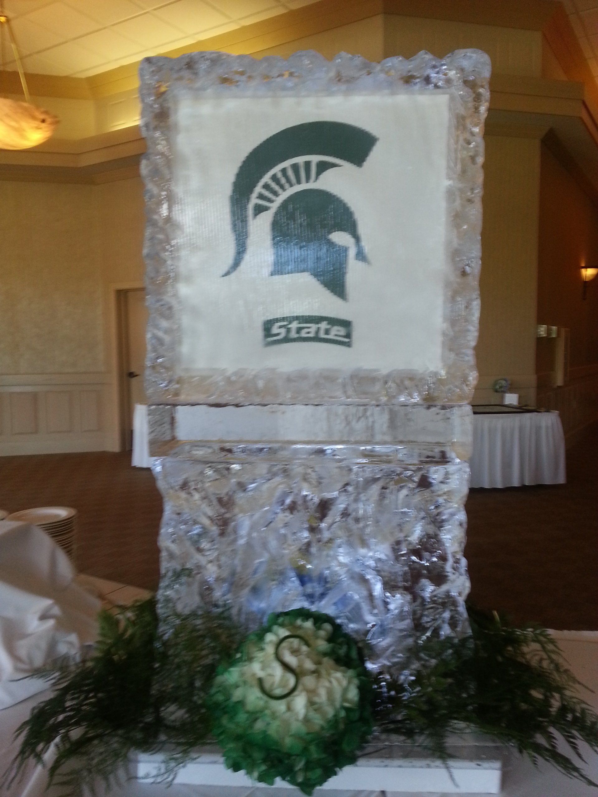A large piece of ice with a spartan helmet on it