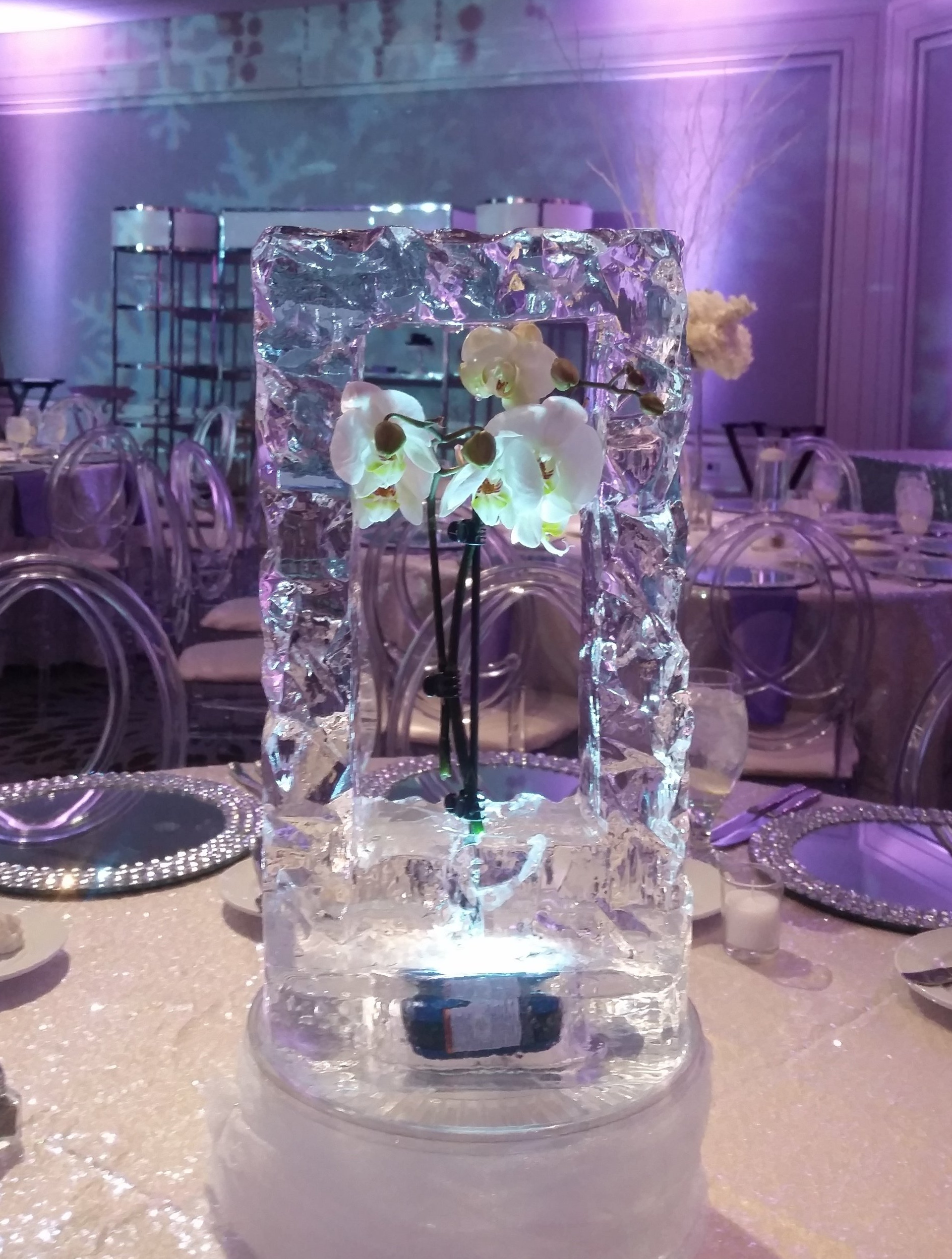 A vase with flowers in it is sitting on a table.