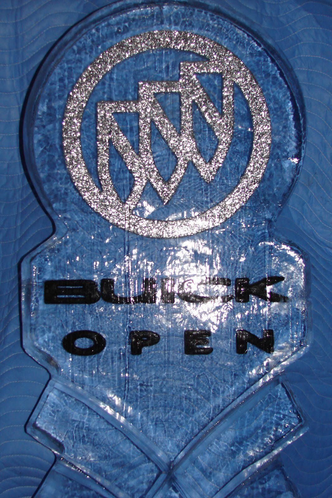 A buick open logo on a blue background