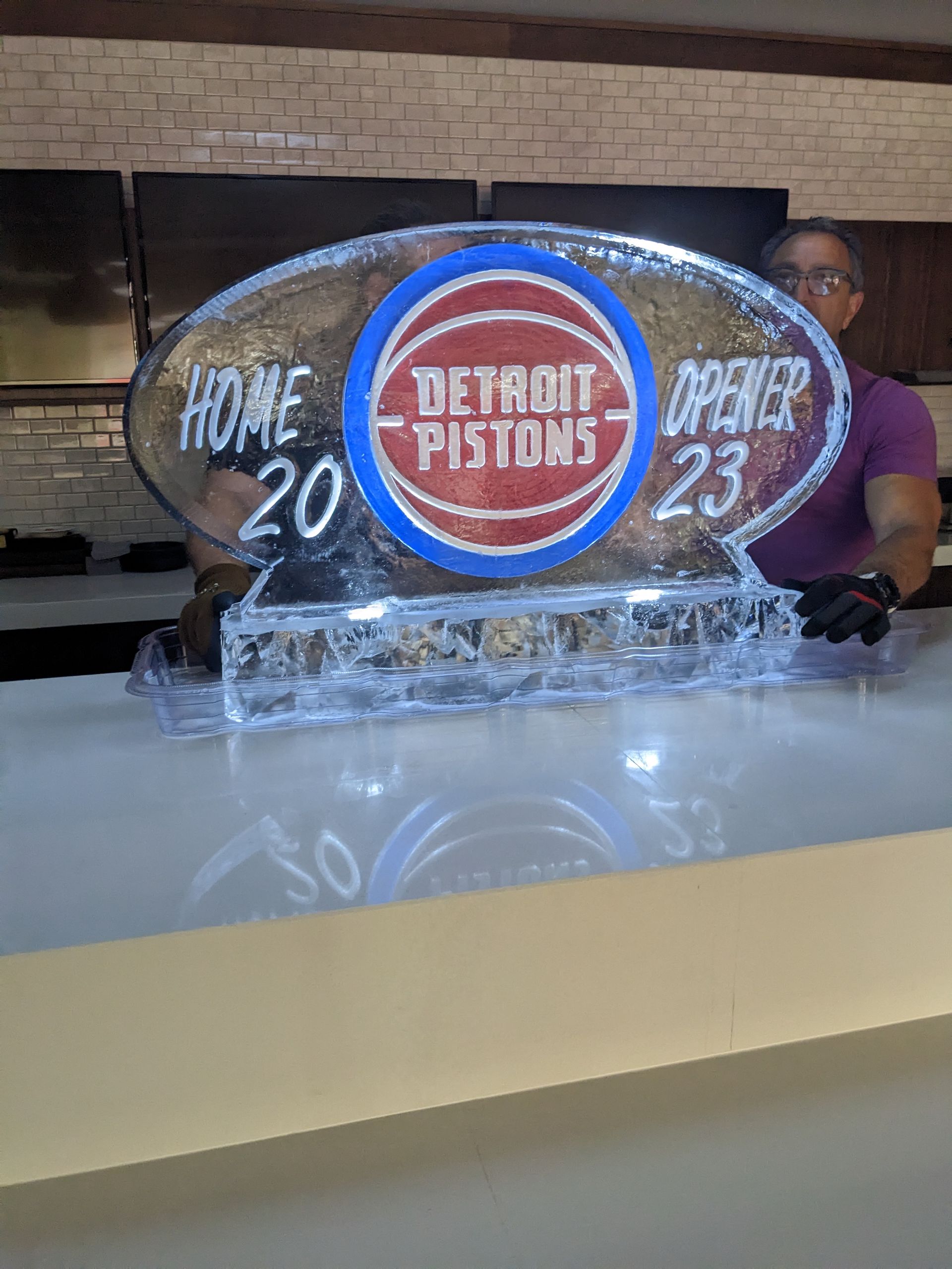 A detroit pistons ice sculpture is sitting on a counter.
