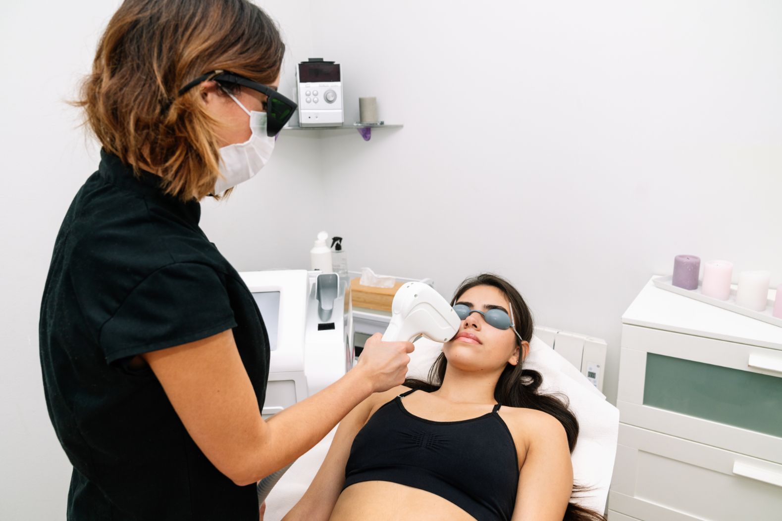 A Woman Is Getting a Laser Treatment on Her Face — Great Bends, KS — Innovative Wellness A Woman Is Getting a Laser Treatment on Her Face — Great Bends, KS — Innovative Wellness