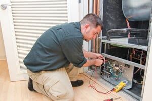 Worker repairing ac