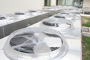 Air conditioners with condenser fans