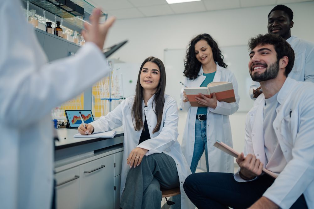 Doctors in a Bright Lab Listening to a Colleague — Blue Stone Medical & Professional in West Rockhampton, QLD