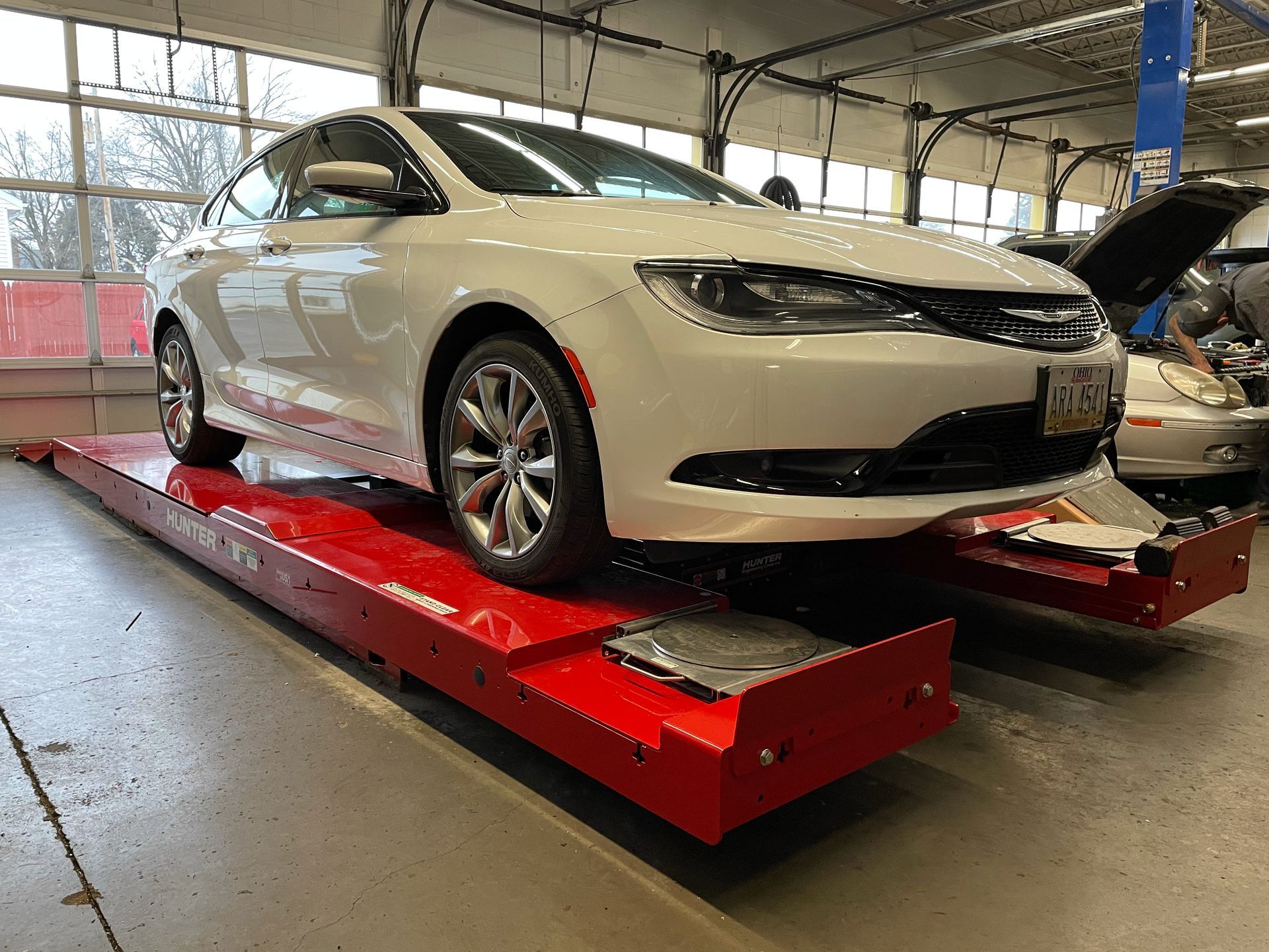 Chrysler at Jamie's Tire & Service receiving a wheel alignment service.