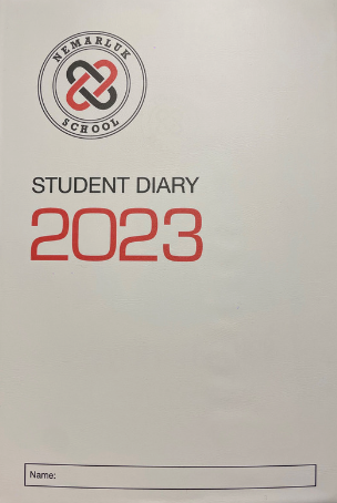 A student diary for the year 2023 with a name tag