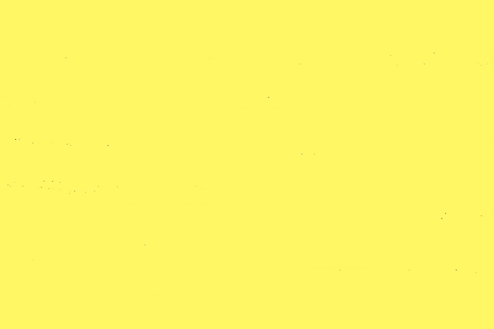 A close up of a bright yellow background.