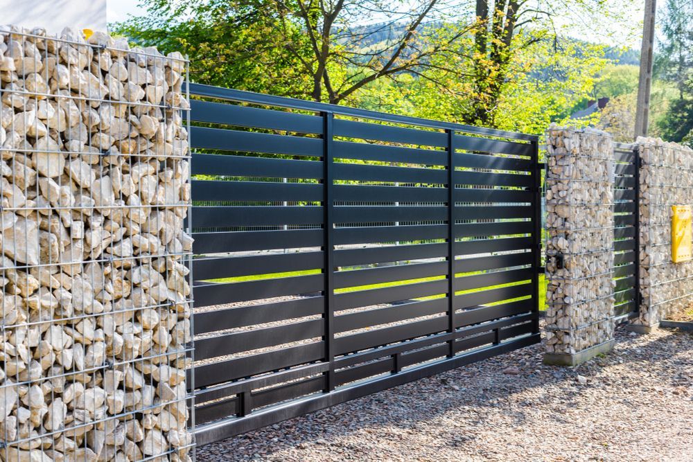 Black Horizontal Gate With Stone Pillars — Metal Fencing Supplies In Wingham, NSW
