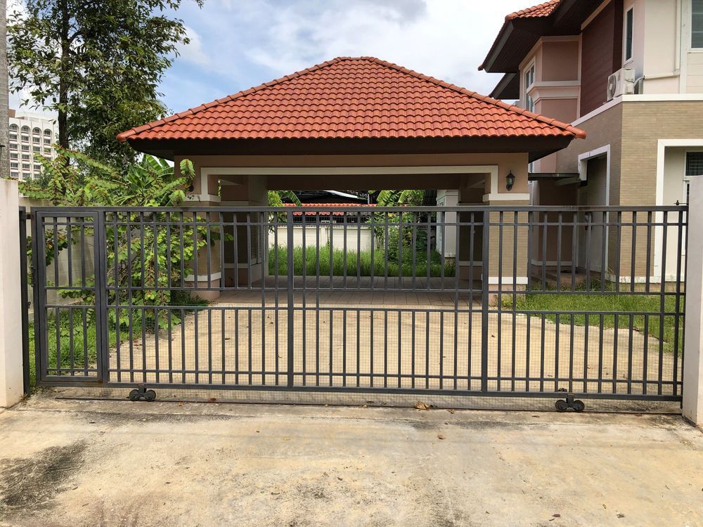 Dark Metal Gate in Front of a Driveway — Metal Fencing Supplies In Wingham, NSW
