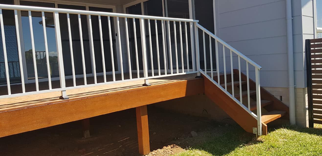 Wooden Deck With White Railing, Steps, and House Siding — Metal Fencing Supplies In Gloucester, NSW