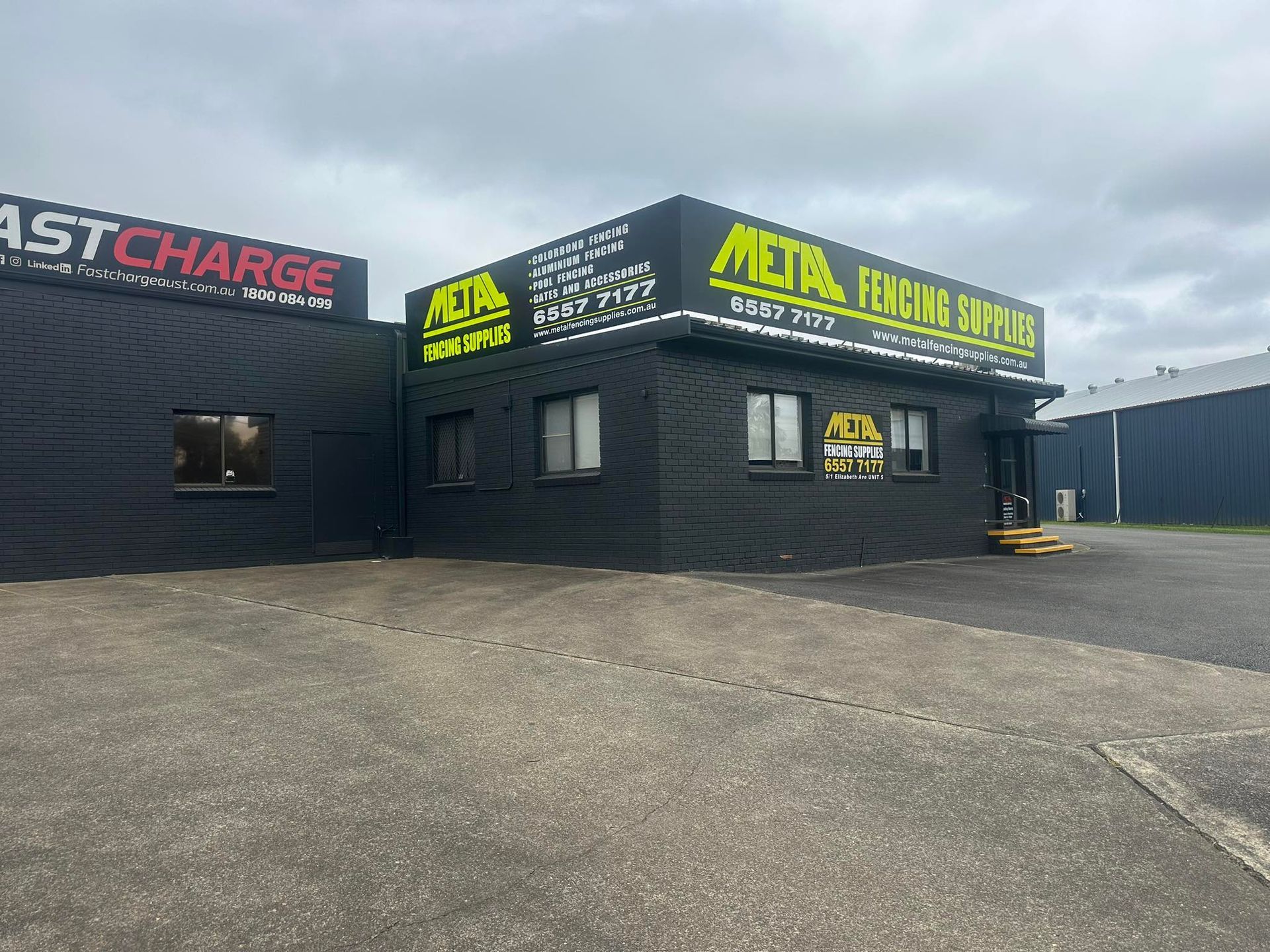 Black Commercial Building — Metal Fencing Supplies In Taree, NSW