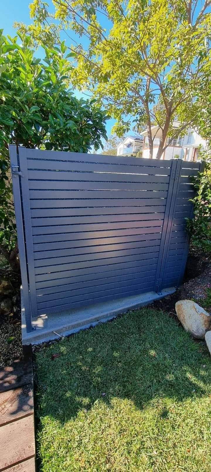 Dark Gray Modern Privacy Fence in a Yard — Metal Fencing Supplies In Taree, NSW