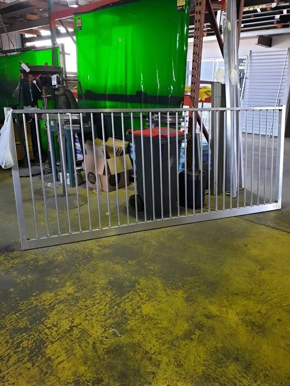 Metal Railing in a Workshop, Vertical Bars, Silver Color — Metal Fencing Supplies In Forster, NSW
