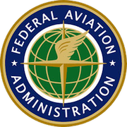 The logo for the federal aviation administration is a globe with a bird 's wing on it.