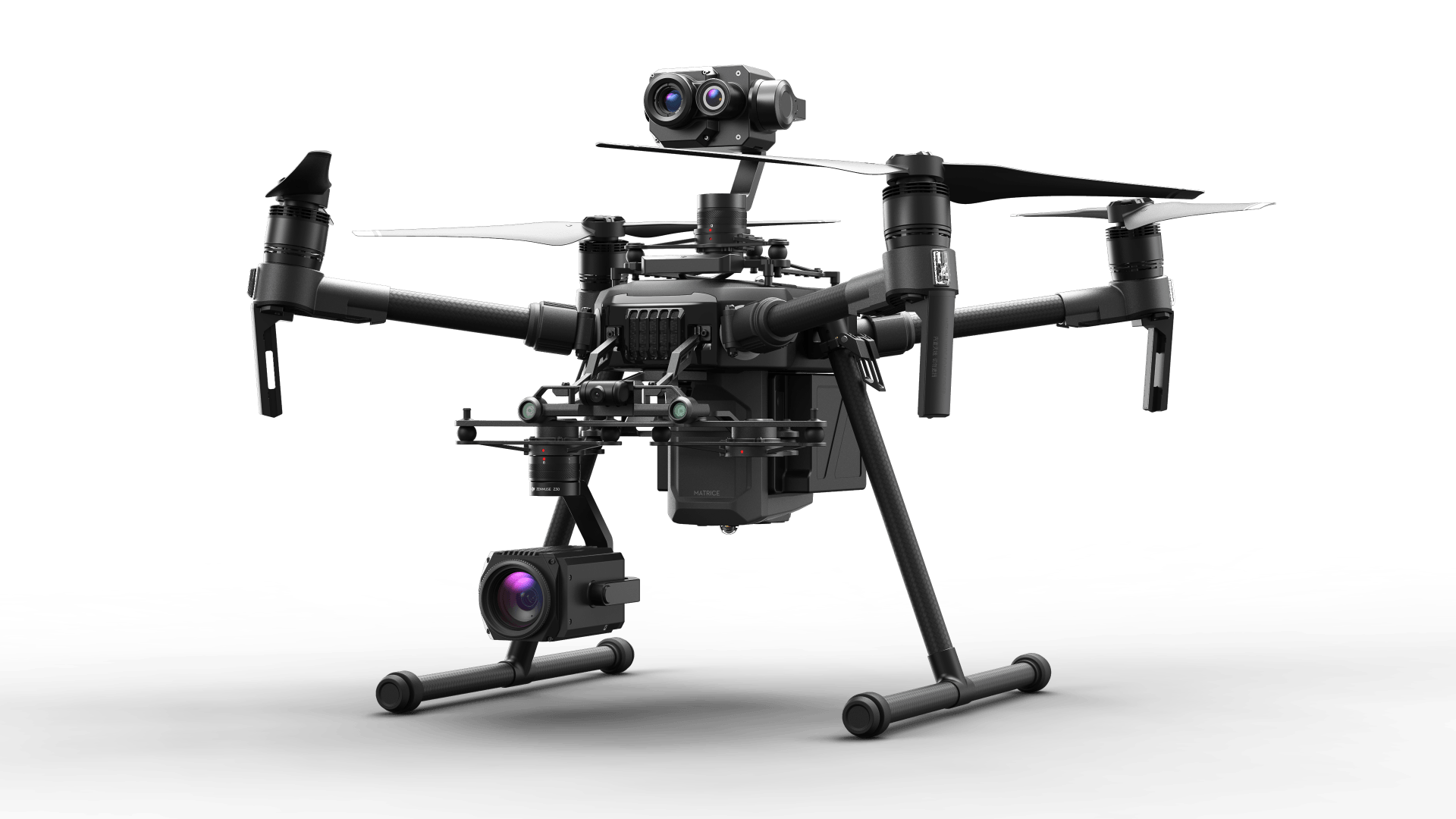 A drone with two cameras attached to it is sitting on a white surface.