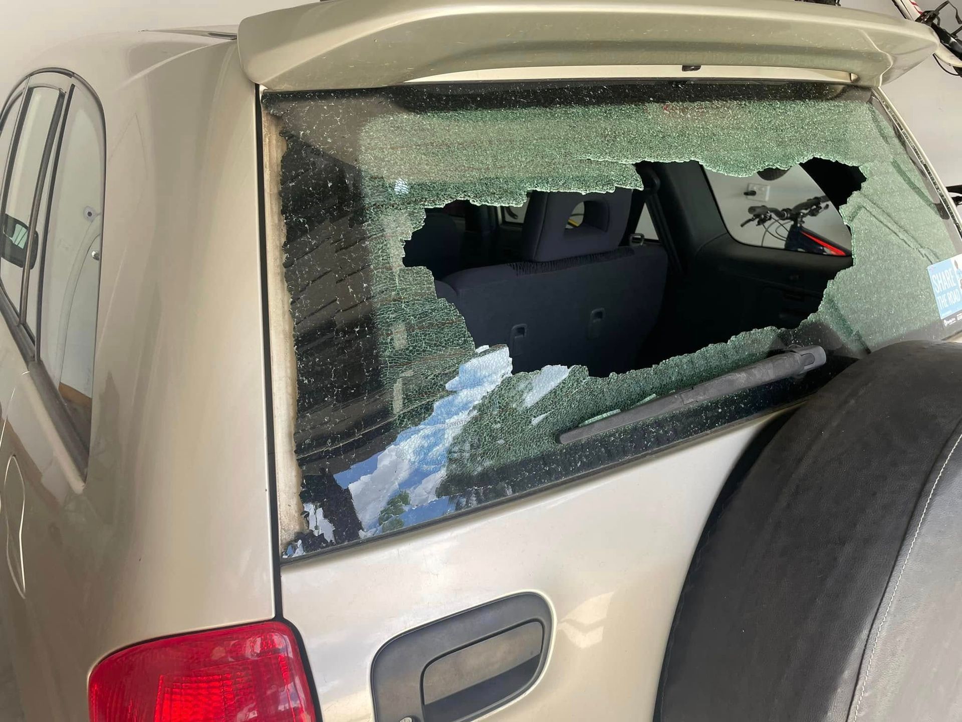 A Car With a Broken Windshield is Parked in a Garage — Bendigo Windscreens In Bendigo, VIC