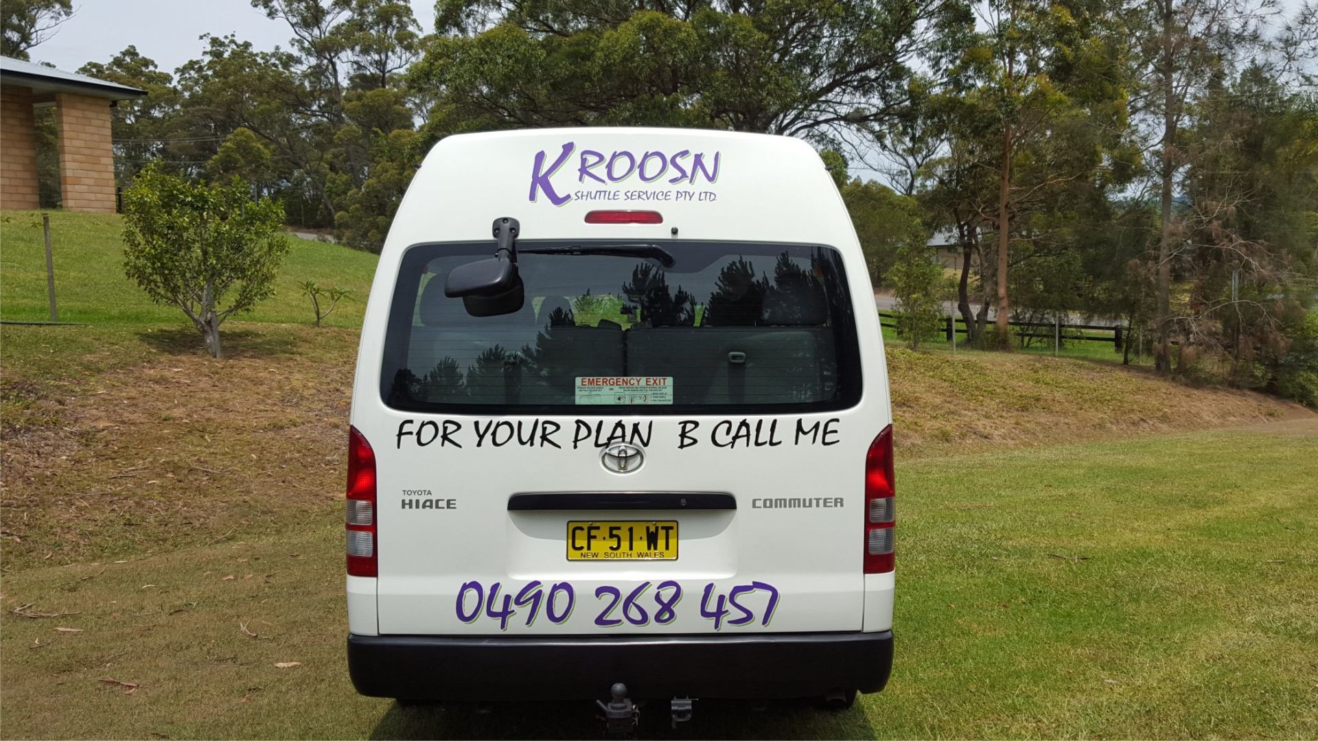 rear view of a mini bus with branding