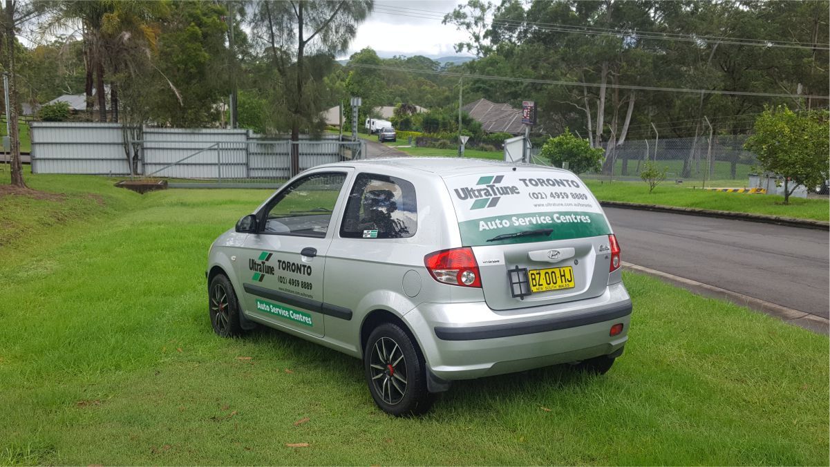Rear view of an automobile with vehicle branding