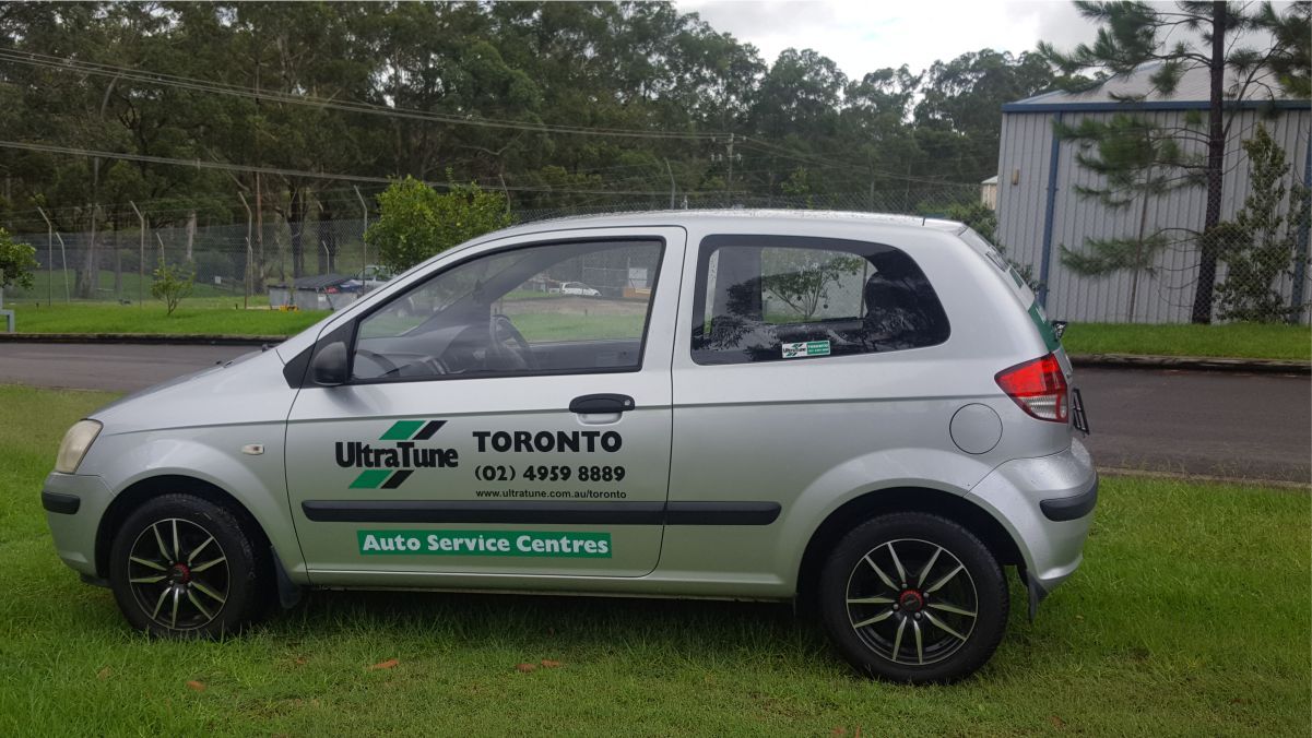 Side view of an automobile with vehicle branding