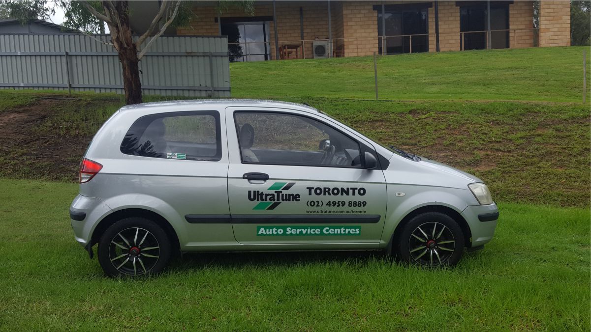 Side view of an automobile with vehicle branding