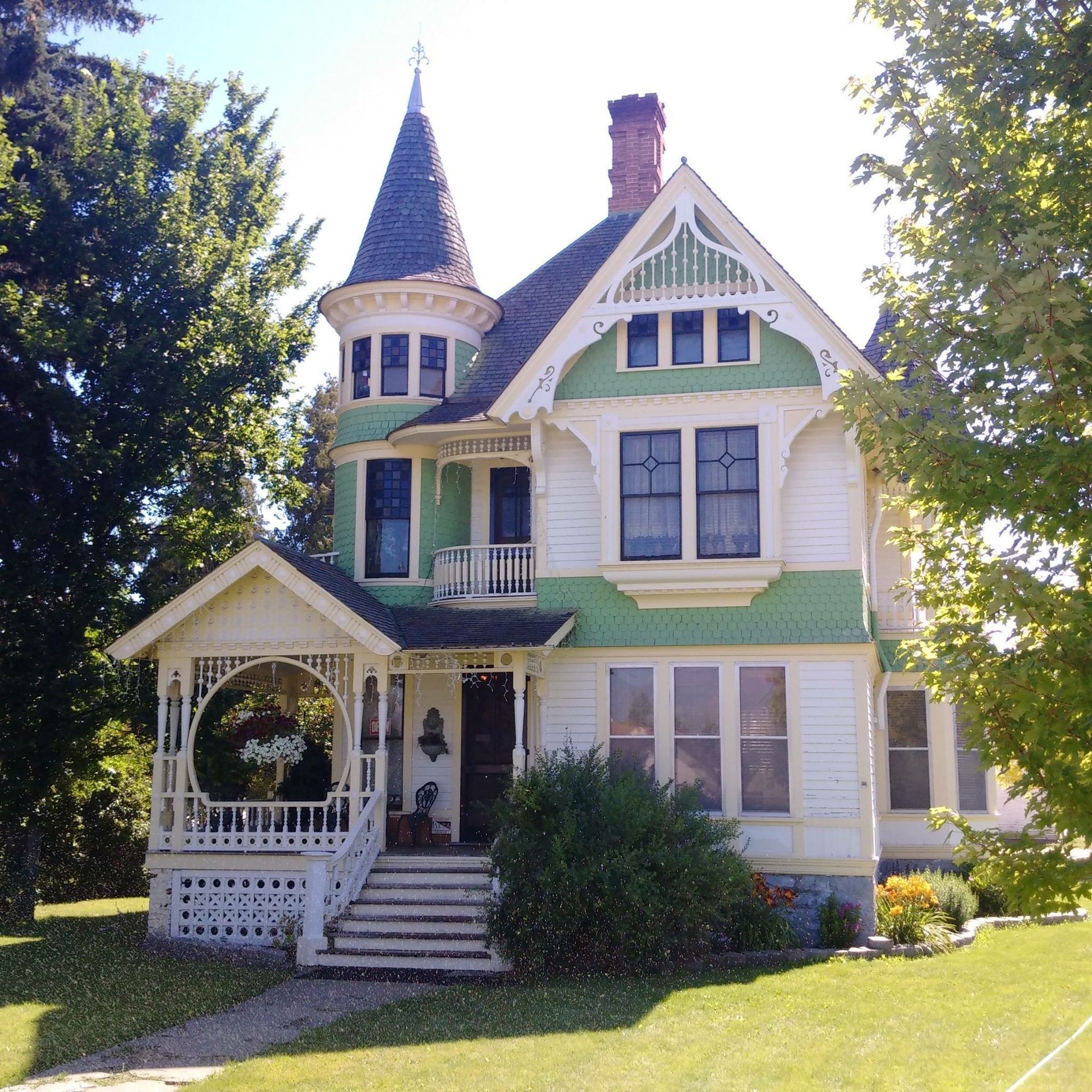 A family is standing in a living room in a new house.