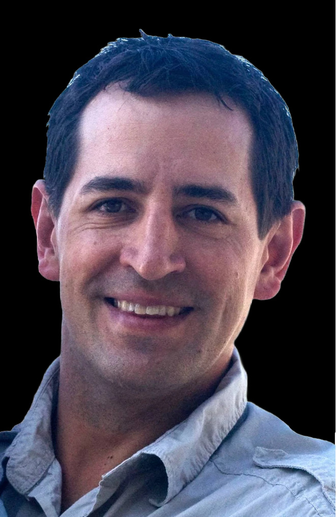 A man in a black scrub is holding a stethoscope in his hand.