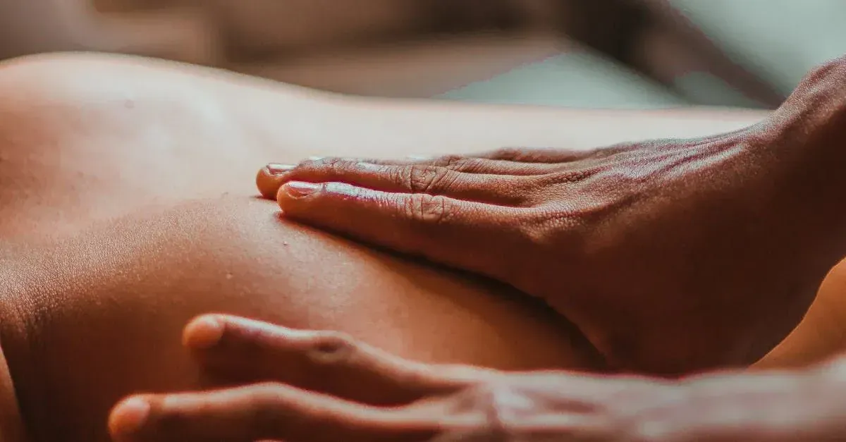 a person is getting a massage on their back
