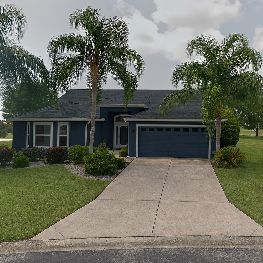 Florida home exterior painted in deep navy blue with white trim by Bushnell Painters