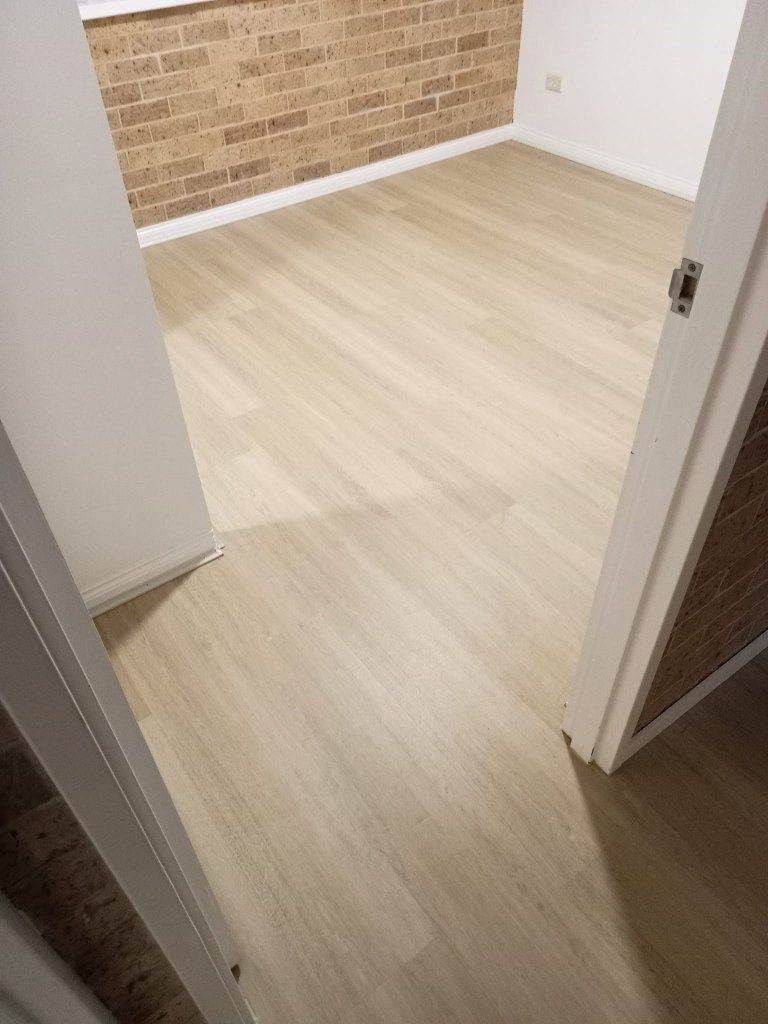 A Room With Light-colored Wooden Floors — BLB Flooring Solutions in Maitland, NSW