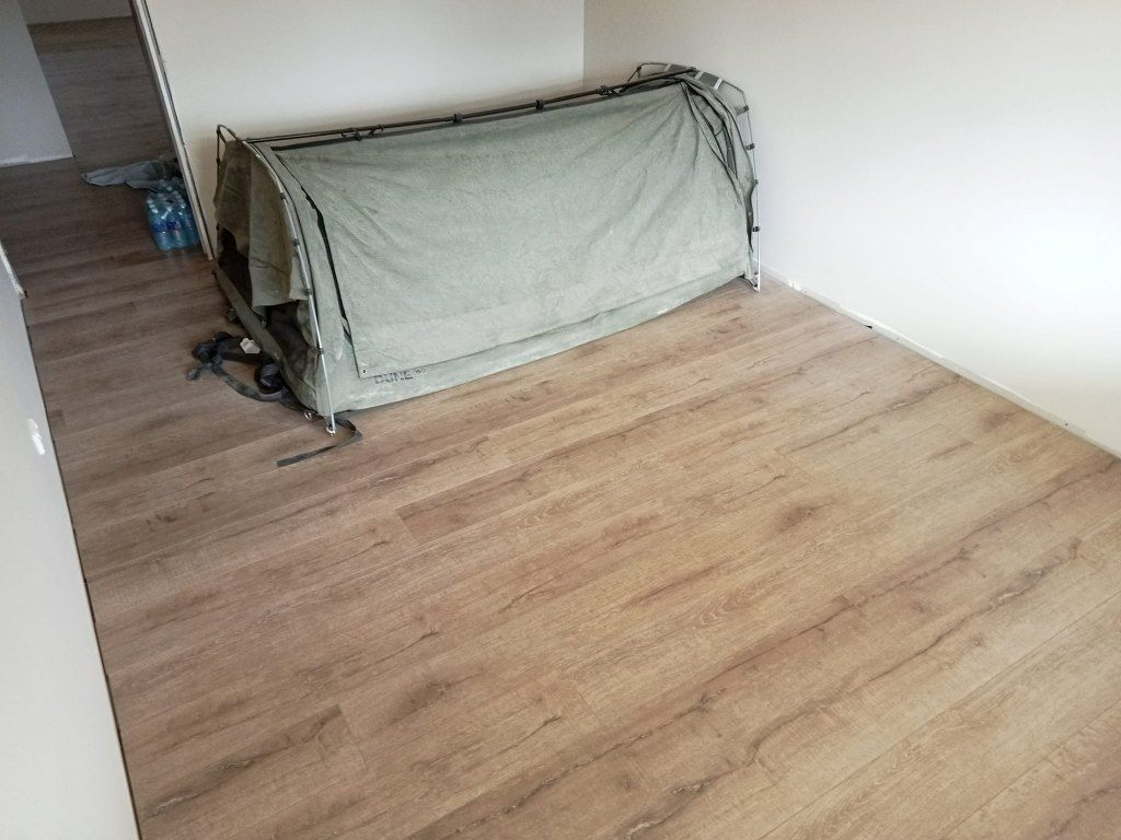 A Wooden Floor in a Room With a Tent — BLB Flooring Solutions in Maitland, NSW
