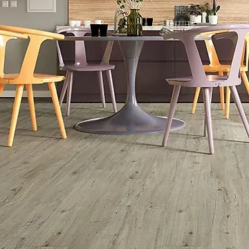 Dining Area With a Gray Tulip Table — BLB Flooring Solutions in Central Coast, NSW