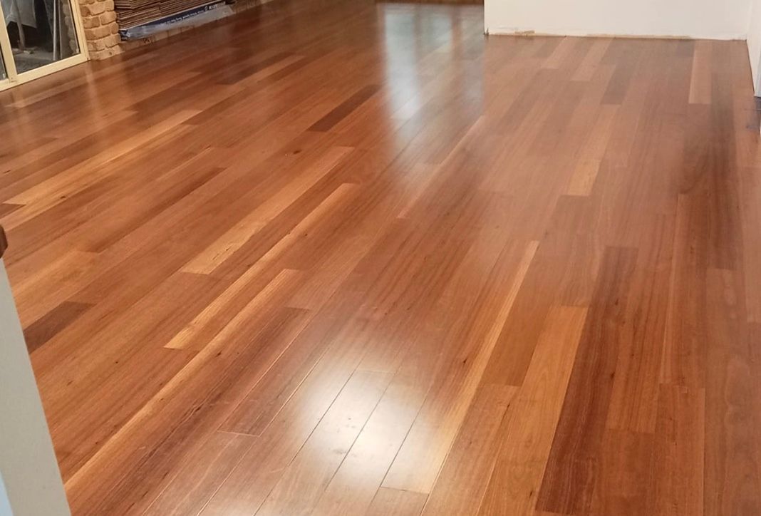Polished Hardwood Flooring With a Reddish-brown Hue — BLB Flooring Solutions in Central Coast, NSW